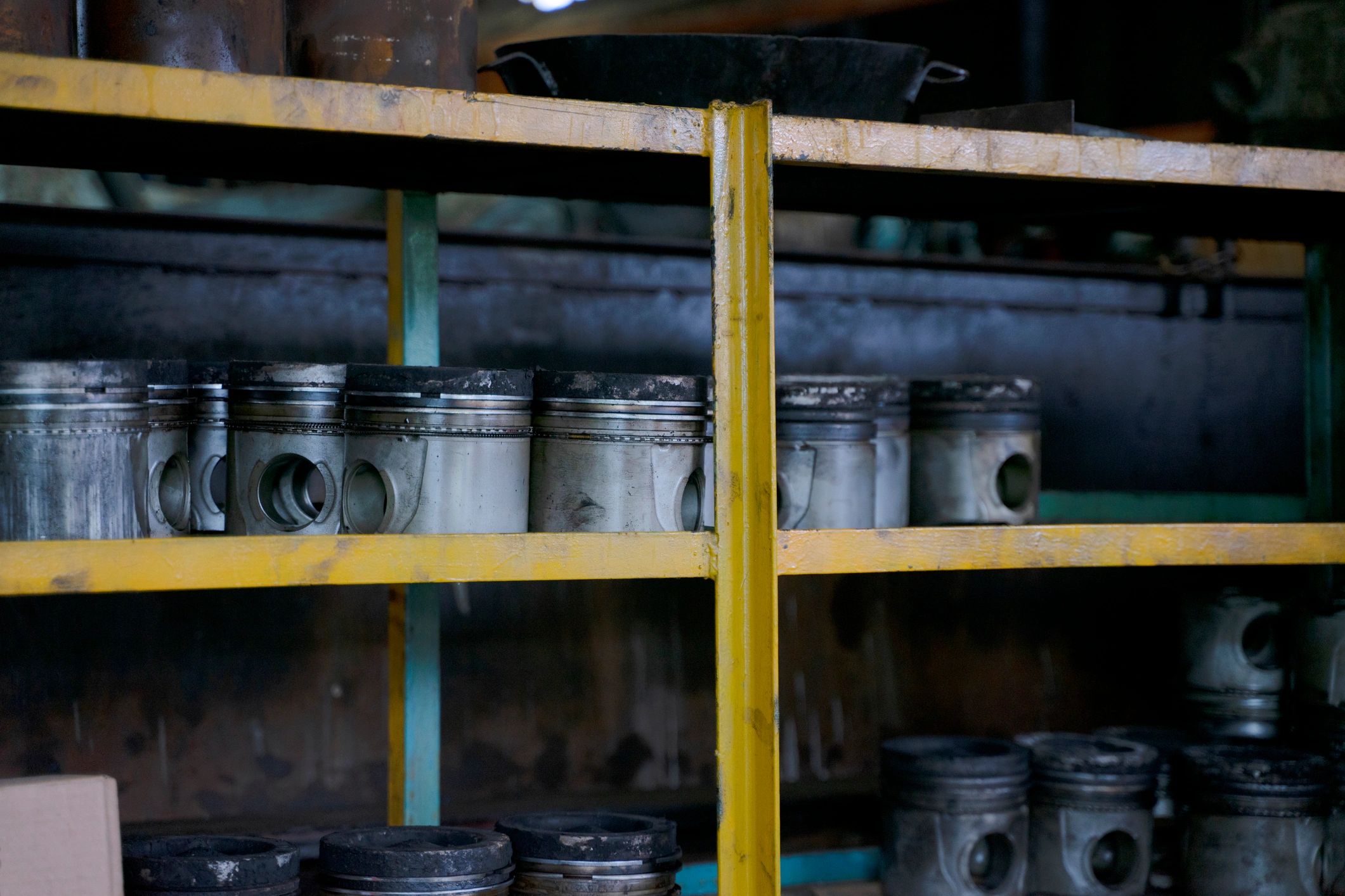 Worker using tools in an industrial setting