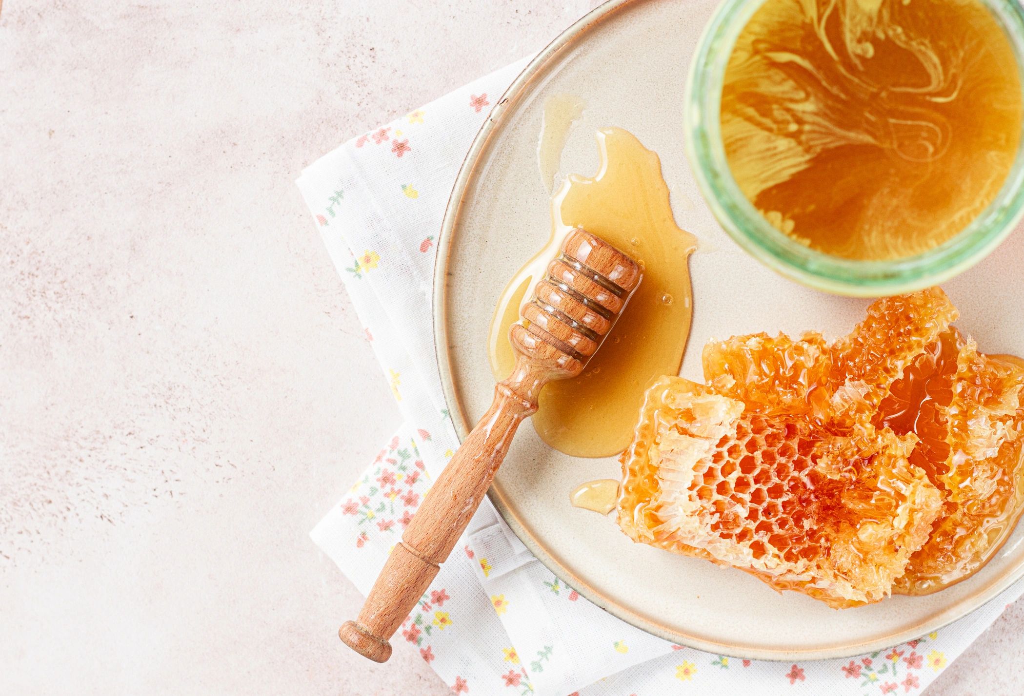 Jar of local honey with honeycomb