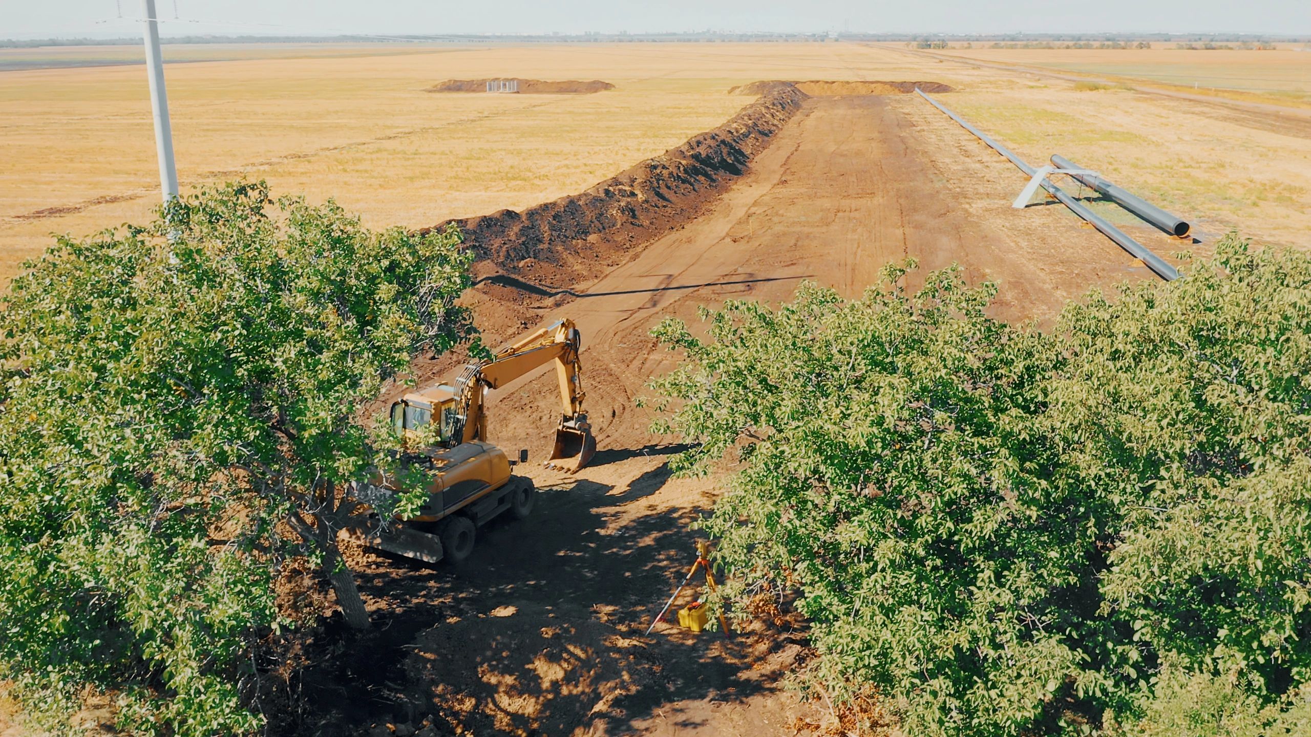 Prepared ground and trench work showing base material application