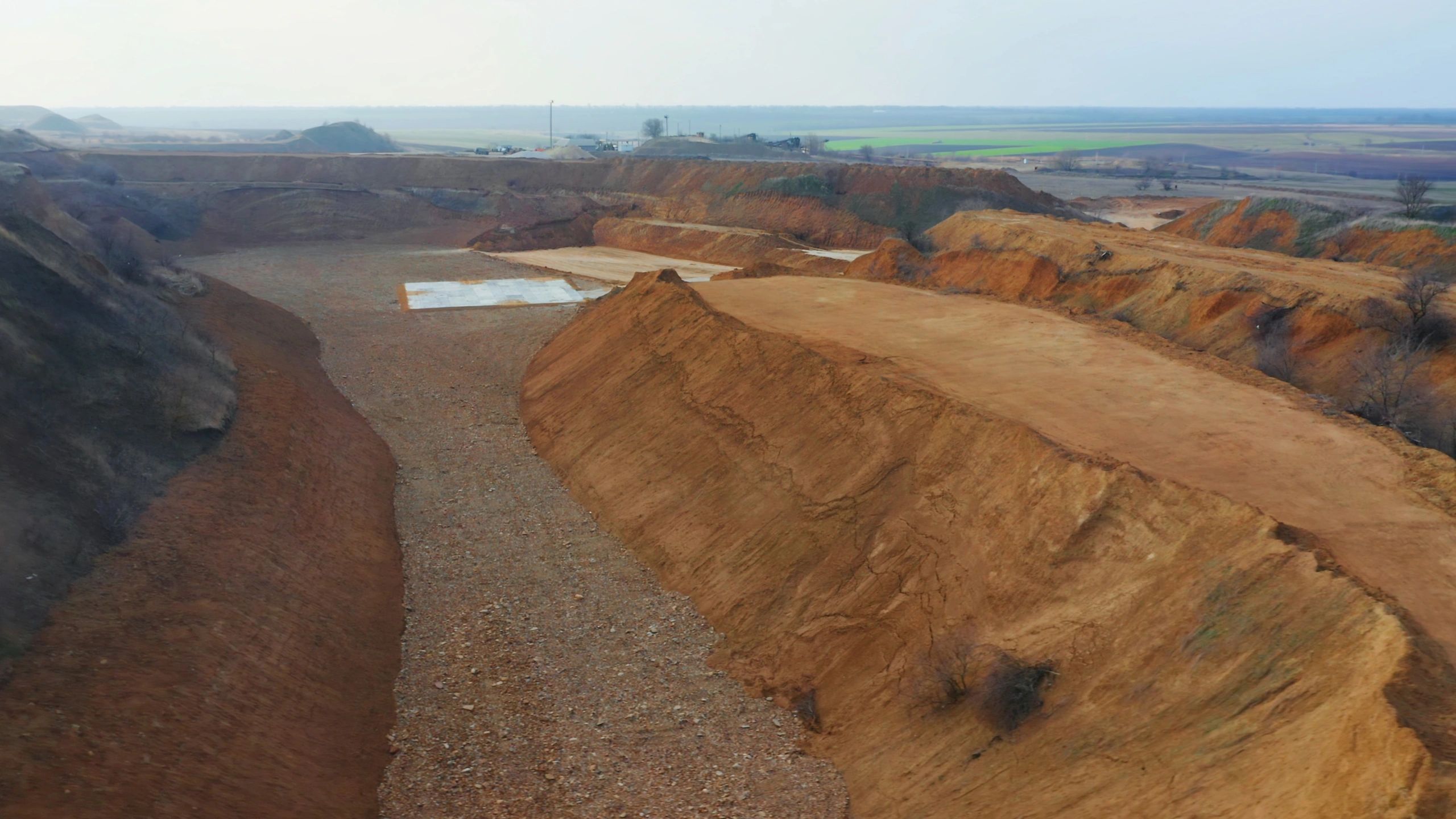 Bulk soil and aggregate material site with excavated earth
